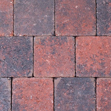 Kobbelstones getrommeld rood-zwart 14x14x7 cm. ~