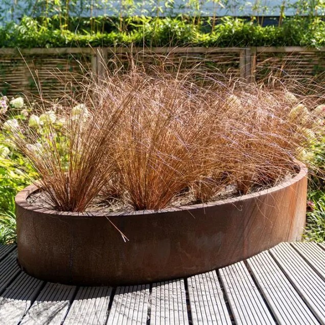 Ellipsvormige CorTen bloembak (LxBxH) 280x160x60 cm. (3 mm.) ~